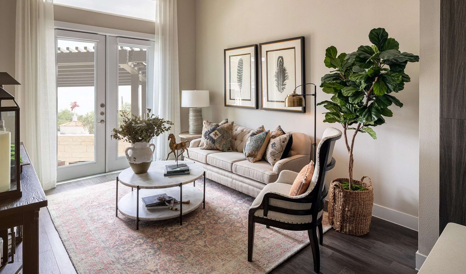 Elegant Features spacious living room with ample natural lighting from windows and modern decor